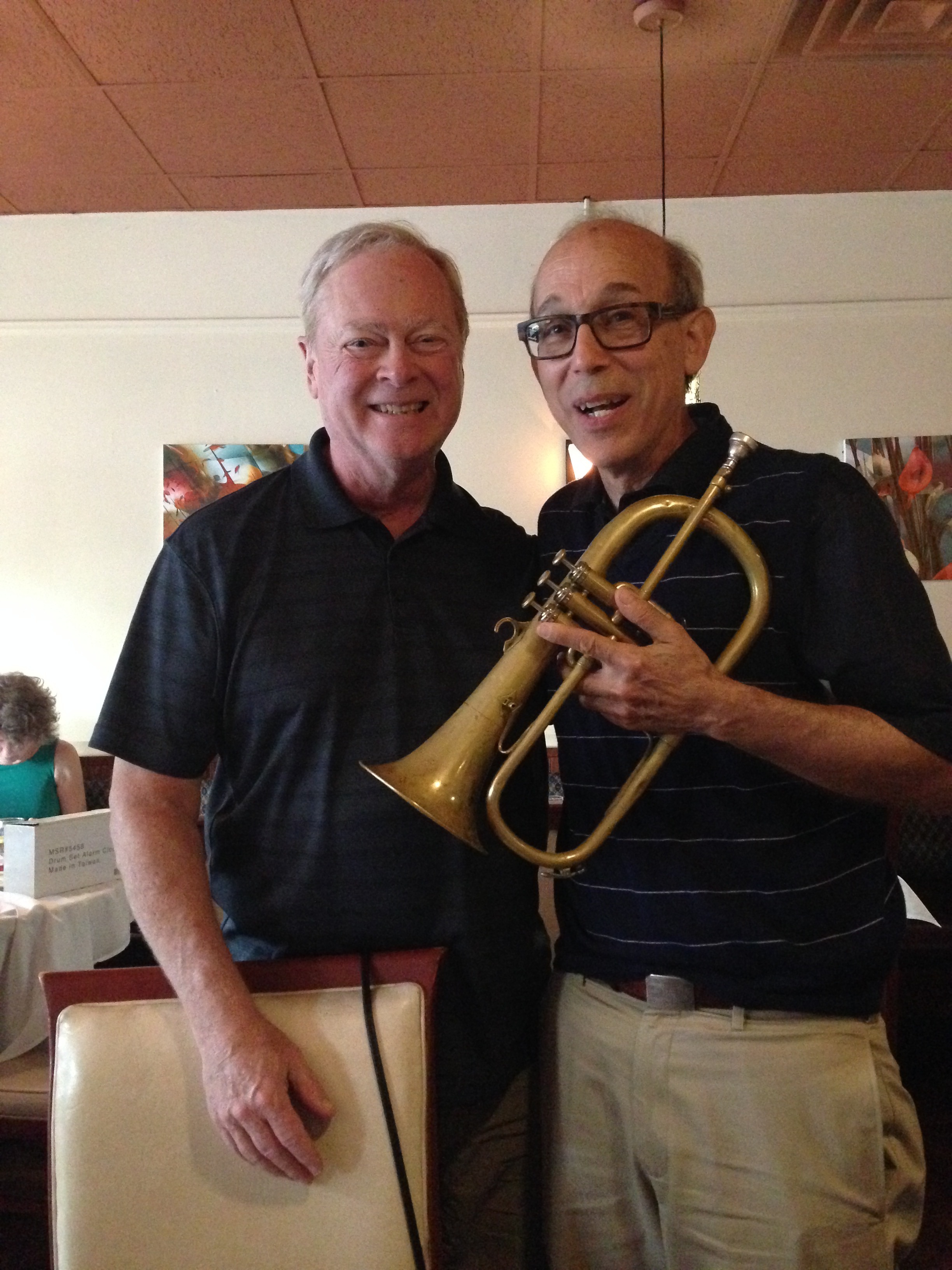 College buddies, Christopher and Bo Winiker, in Brookline, Massachusetts. Bo is holding his trumpet.